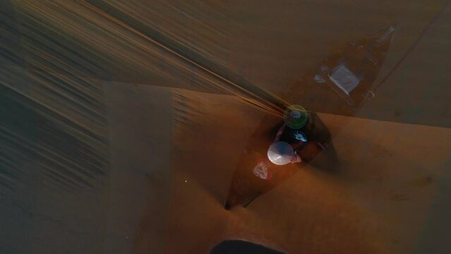 Fishermen throwing fishing net during dawn with boats at the sea gate. Concept Fisherman's life style. Cua Dai, Hoi An, Asia, Vietnam.