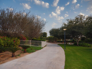 Large green evening park in the big city, Umm Al Emarat Park in Abu Dhabi UAE. park with indoor pavilion and botanical garden