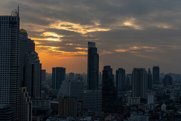 Fototapeta na wymiar Bangkok skyline at sunset time from a building (Scarlett Wine bar & restaurant), Thailand