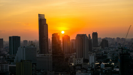 Fototapeta na wymiar Bangkok skyline at sunset time from a building (Scarlett Wine bar & restaurant), Thailand