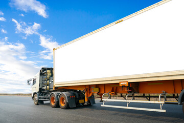Semi Trailer Truck Driving on The Road. Shipping Container Blank Space For Advertising, Logo, Text....