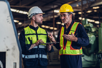 Workers Factory or Engineering work at factory site check up machine or products in site. Foreman or Technician checking Material or Machine on Plant. Heavy industry factory concept.
