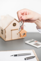 Mortgage. Apartment purchase. Keys to a new apartment. The realtor hands over the keys to the apartment to the buyer.