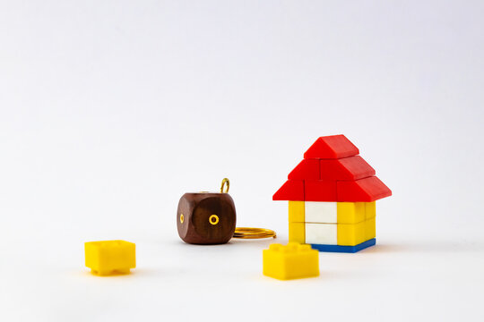 High angle shot of a Bricks house with key chain and white background.