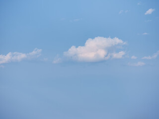 Naklejka na ściany i meble Serenely floating clouds in sky