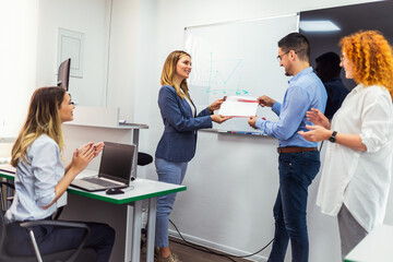 Computer school participants receive certificates of completion of the course.