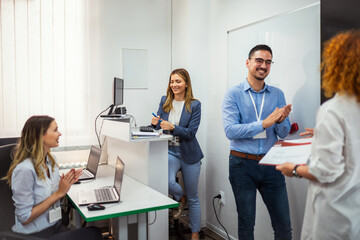 Computer school participants receive certificates of completion of the course.