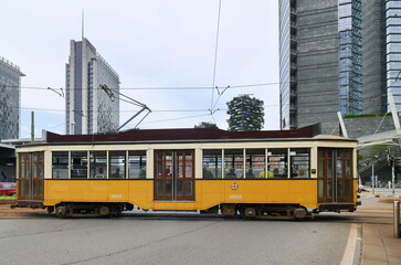 Fototapeta na wymiar Historic tram in Milan. Milan transportation system carries 2 million passengers daily