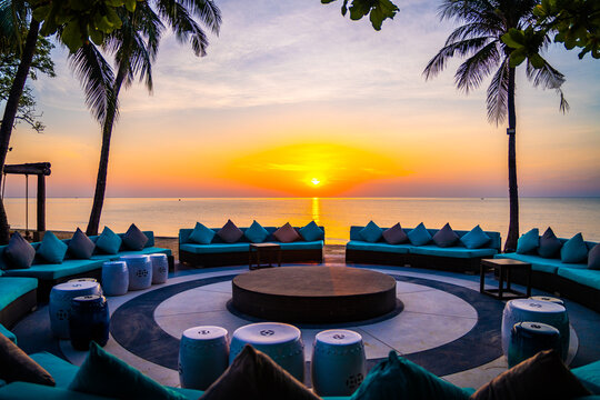 Beachfront sunrise with pool and palm trees in Hua Hin, Prachuap Khiri Khan, Thailand