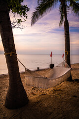 Beachfront sunrise with pool and palm trees in Hua Hin, Prachuap Khiri Khan, Thailand