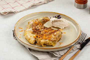Portion of gourmet cooked chicken with nut cream