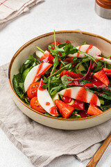 Portion of healthy colorful salad with strawberry and greens