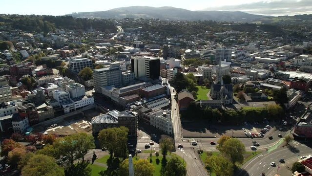 Beautiful birds eye view of Dunedin city centre during sunny day on New Zealand coast.
