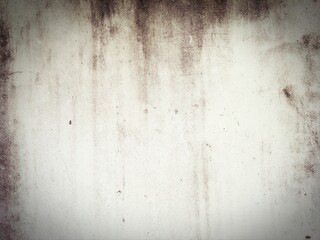 Fototapeta premium The old cement wall has black stains from moss.