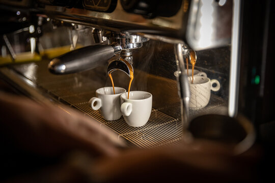 Espresso machine pouring coffee
