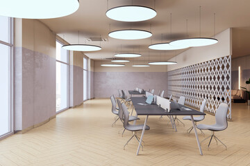 Side view of open space office coworking interior with comfortable workplaces, long desk with laptops, wooden floor, grey walls, and contemporary ceiling lamps. Modern workspace design. 3D Rendering
