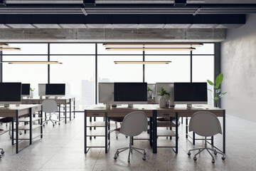 Modern open loft office interior with desks, computers, a stone floor, and grey walls. A window provides natural light. Modern workspace design and business background. 3D Rendering