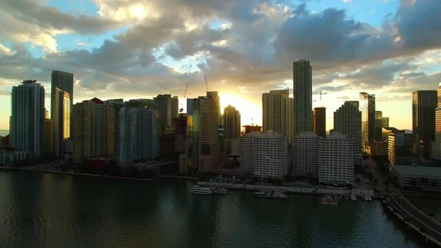 Aerial Shot Of Sea Near Modern Buildings In City Against Sky, Drone Ascending During Sunset - Miami, Florida