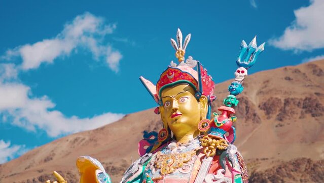 Closeup shot of statue of Guru Padmasambhava besides the Sani Lake near the Sani Monastery in Sani village near Padum in Zanskar, Ladakh, India. Statue besides the holy lake and in front of mountains