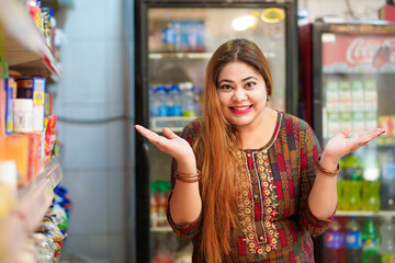 Happy indian woman at grocery shop