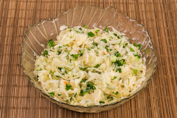 Salad of sauerkraut with carrots and green onion close-up