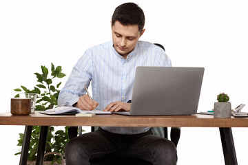 businessman in blue shirt taking notes, doing market research working