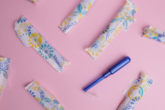 Magdalinovka, Ukraine - June 2, 2023. Tampax tampons in a wrapper background, texture