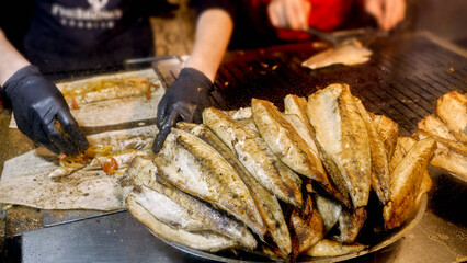 Making traditional Turkish Balik Ekmek street food at evening