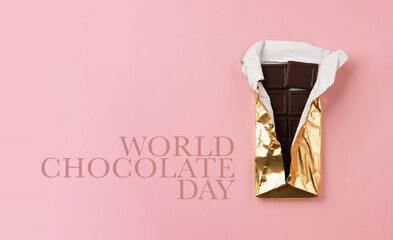 World Chocolate Day concept. Dark Chocolate on pink background.