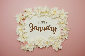 Happy January card typography text with flower on pink background