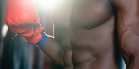 Inspirational exercise and fitness portrait of African American male athlete, intense and powerful...