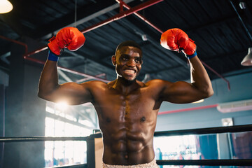 Inspirational exercise and fitness portrait of African American male athlete, intense and powerful...