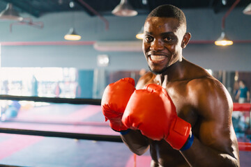 Inspirational exercise and fitness portrait of African American male athlete, intense and powerful...