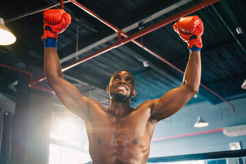 Inspirational exercise and fitness portrait of African American male athlete, intense and powerful...