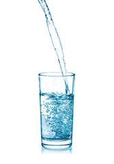 pouring water on a glass on white background
