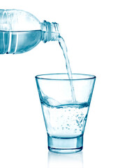 pouring water on a glass on white background