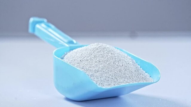 Plastic grains in spoon close up. 
