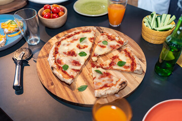 pizza on a table with varius elements