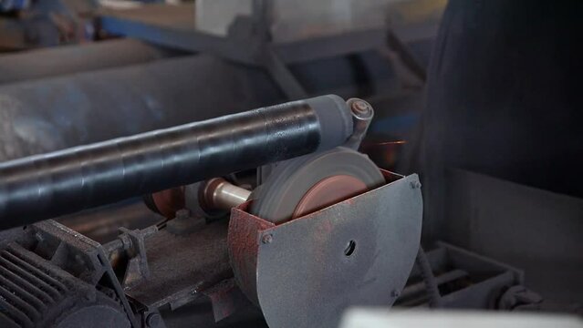Pipe manufacturing plant. Pipe plant. Iron pipe welding. Pipe expansion. Sparks of welding. Tap. Factory. Machine tools. Production. Heavy industry.