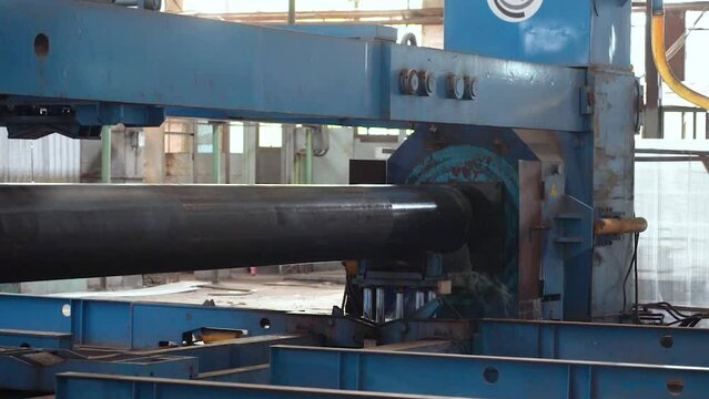 Pipe manufacturing plant. Tube plant. Iron pipe welding. Pipe expansion. Tap. Factory. Machine tools. Production. Heavy industry.