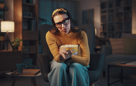 Bored Woman Watching TV At Home