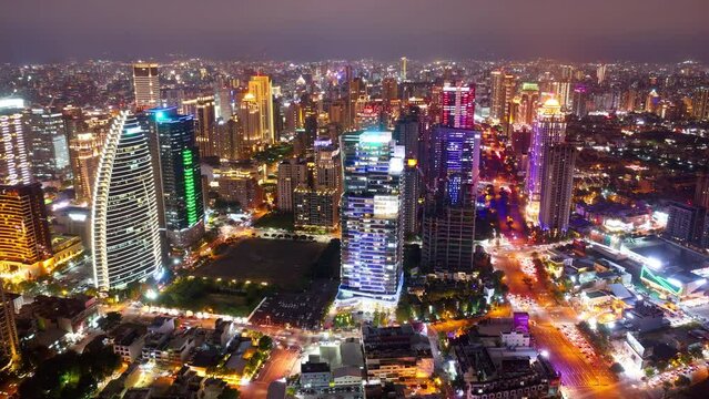 Aerial skyline of Downtown Taichung, a vibrant metropolis in central Taiwan, with modern high-rise office towers booming in the 7th Redevelopment Zone and city lights dazzling at night (in hyperlapse)