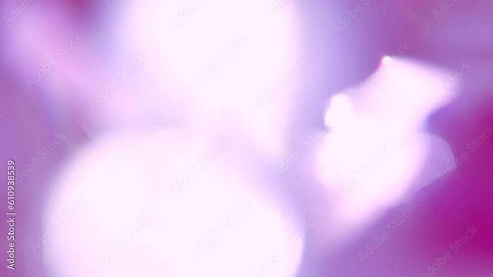 Wall mural violet spectrum lens. loop. the light passes through the facets of a slowly rotating diamond and cre
