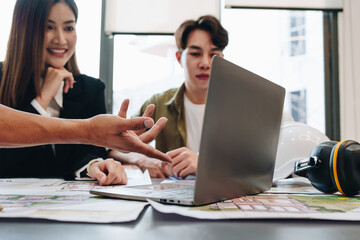 Engineers, designers and interior designers are finalizing the design of interiors by discussing selecting materials and colors to design rooms to present to clients.