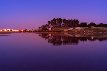 Beautiful Sunset in Croatia. Sunlight on the shore of Sea. Beautiful colors. Reflection on the edge of coast.