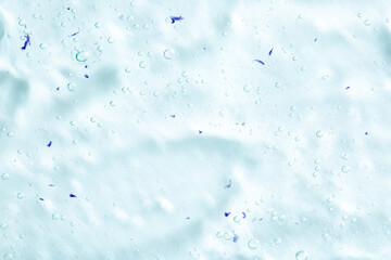 Cosmetic gel, serum transparent sample. Liquid cream with bubble texture. Gel texture of a cosmetic product. Clear liquid lotion for skin care.