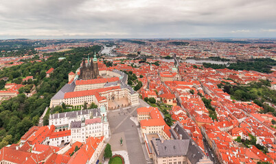 Naklejka premium Prague Old Town with St. Vitus Cathedral and Prague castle complex with buildings revealing architecture from Roman style to Gothic 20th century. Prague, capital city of the Czech Republic. Drone