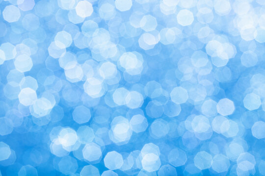 Blue glittering background for design and free space.