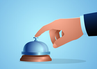 Close-up of businessman’s hand pressing concierge bell