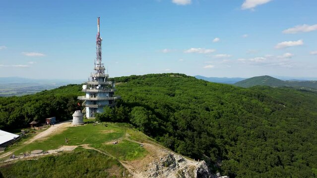 Green forests on Zobor Mountain and view of Pyramid Radio tower, 4k